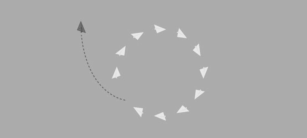 imagem de aviões de papel voando em círculo e 1 deles quebrando o padrão e saindo de formação - contraposição à visão do Sheikh Rashid sobre o Desenvolvimento humano